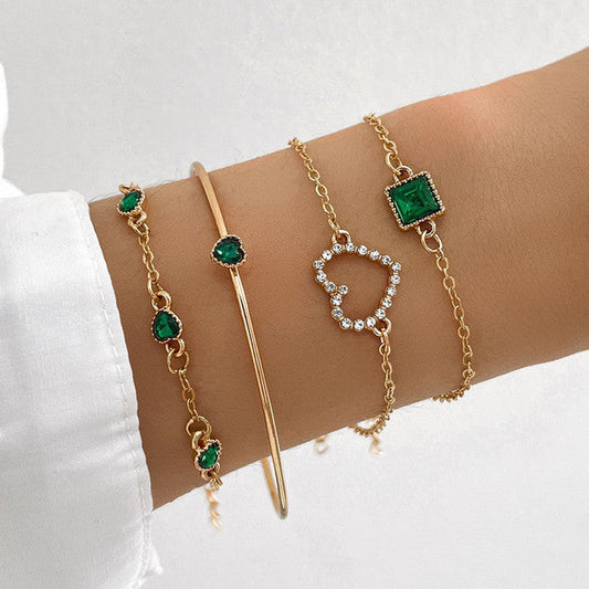 Armbåndspakke med grønne zirkonia i guld
