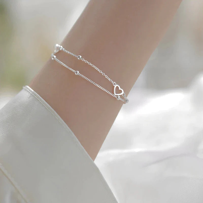 Justerbar sølv hjerte armbånd